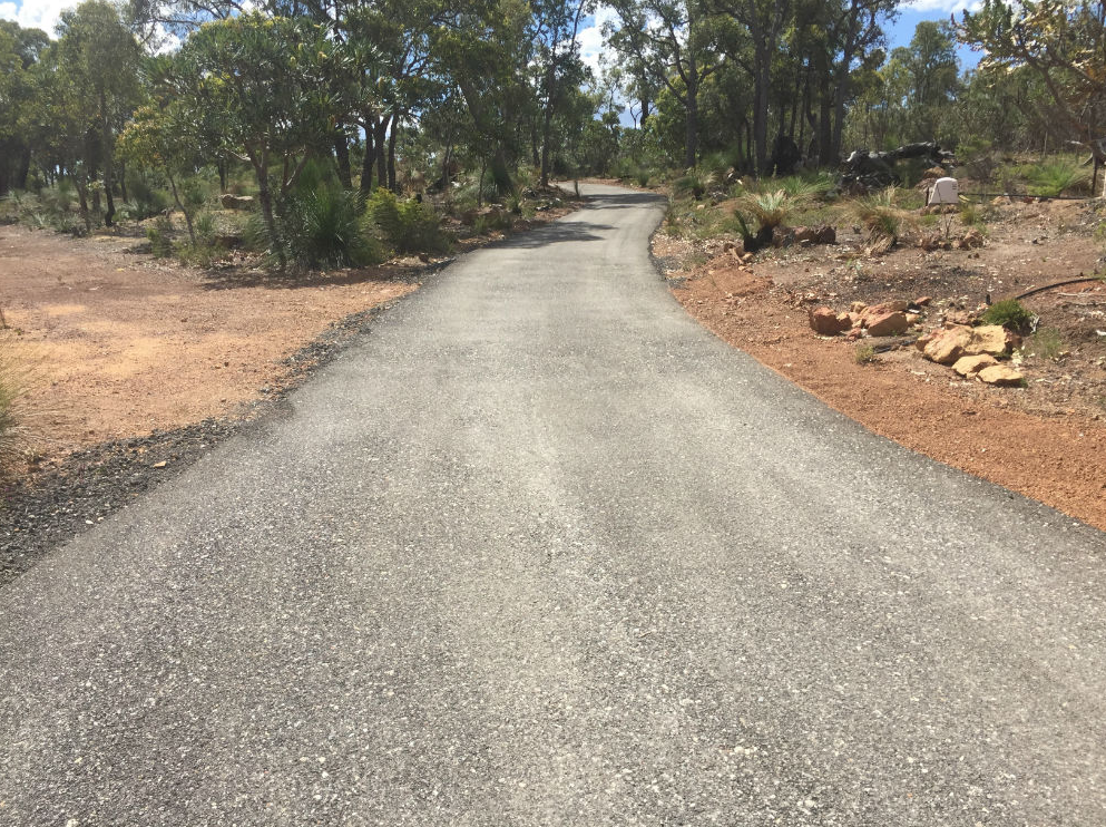 This is a photo of a hot spray & seal bitumen driveway which is in the process of being installed by Ballarat Road Tech